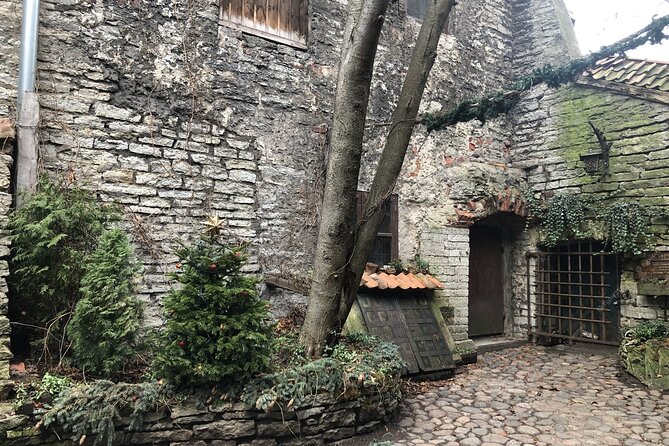 Group walking tour in Tallinn Old Town - Kiek in de Kok and Bastion Passages, then St. Olaf’s Church for scale